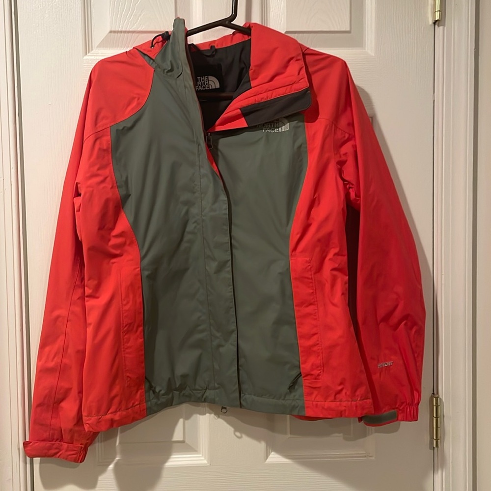 Red and grey North Face windbreaker jacket